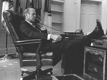 Black and White Photo Man with Feet on Desk